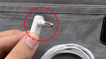 Image showing white grounding sheet cord for electrical outlet with red circle