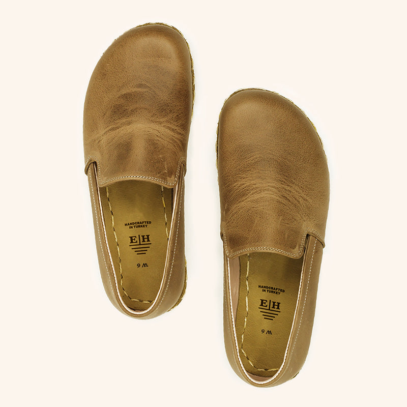 Grounding Slip On Unisex Shoes that are handmade with Natural Beige Brown Top-Grain Leather and Water Buffalo Leather Soles Shown From Top View