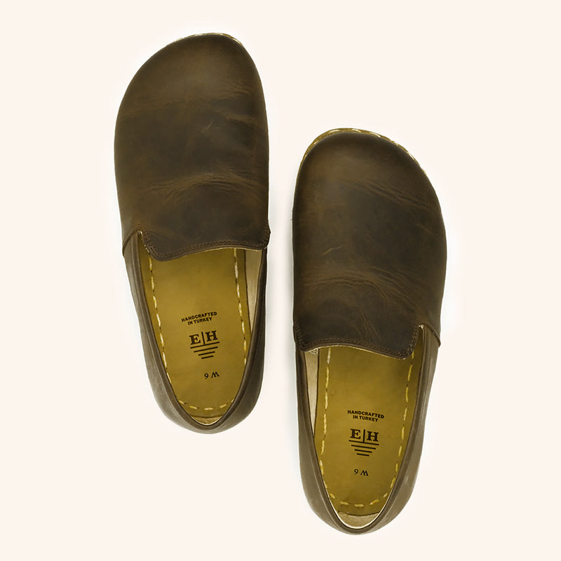 Grounding Slip On Unisex Shoes that are handmade with Natural Dark Brown Top-Grain Leather and Water Buffalo Leather Soles Shown From Top View 