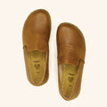 Grounding Slip On Unisex Shoes that are handmade with Natural Honey Brown Top-Grain Leather and Water Buffalo Leather Soles Shown From Top View