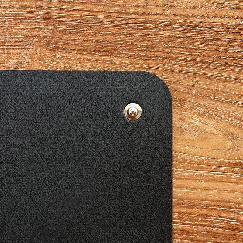 Close up detail image of snap up connection of Earthing mat pad that can be used for EMF protection, under desk with bare feet and for sleeping in bed